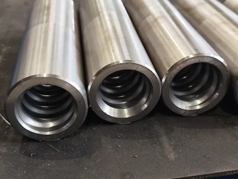 Manguito de acoplamiento para perforación de rocas